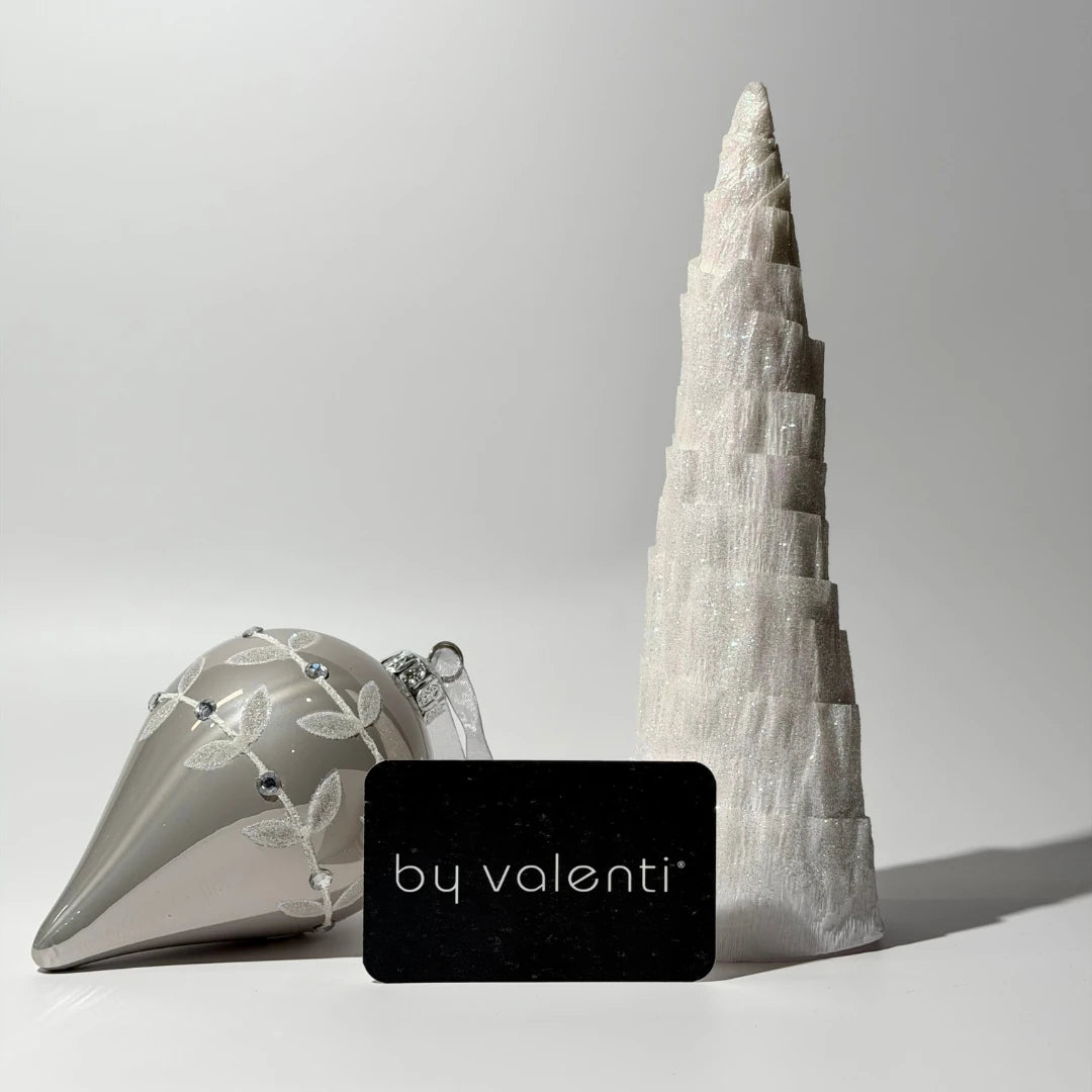 White and silver christmas decorations with a black by valenti gift card 